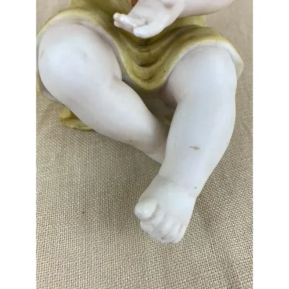Vintage Bisque Porcelain Piano Baby Figurine 7”